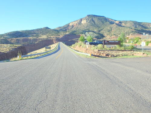 GDMBR: The visitor's center on the right and the dam road ahead.